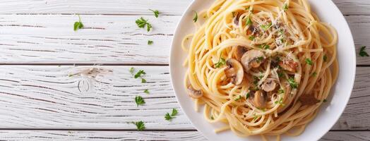 Spaghetti with mushrooms and parmesan on a white wooden table photo