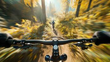 A person riding a mountain bike on a trail photo