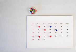 push pin stack in calendar background photo