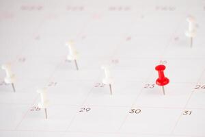 schedule calendar with push pin background photo