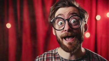 A man with glasses and a beard is making a funny face photo