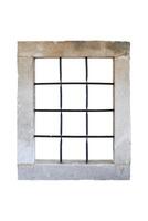 Ancient castle window with a stone frame and iron bars, set in an old stone building, evoking medieval security and historical architecture photo