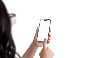 Woman holding a modern smartphone in her left hand while tapping the screen with her right hand, over the shoulder view, isolated display for mockup photo