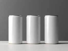 Three empty aluminum cans on a table with a gray background photo