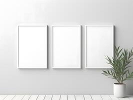 Three empty frames on a wall with a plant photo