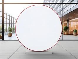 A large round white sign in front of a building photo