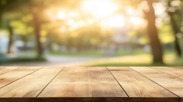 Empty wooden table top with blurred park or garden background with sunlight filtering through trees photo