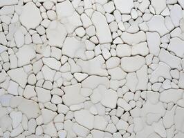 A white stone wall with many different shapes photo