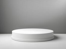 Round white pedestal on a table with a gray background photo