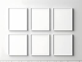 Blank white frames on a wall with a wooden shelf photo