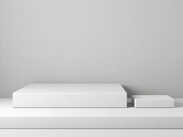 White boxes on a shelf in front of a gray wall photo