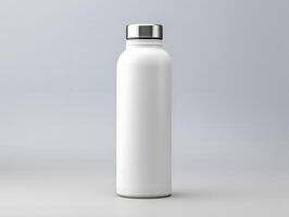 White plastic bottle with silver lid on gray background photo
