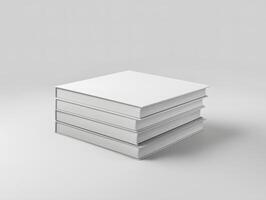 Stack of white books on a plain surface photo