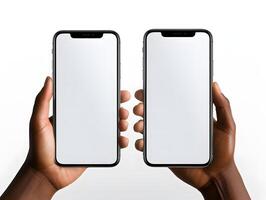 Two hands holding two iphones with blank screens photo