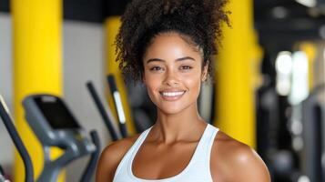 Athletic woman smiling in vibrant gym setting, showcasing fitness and health photo