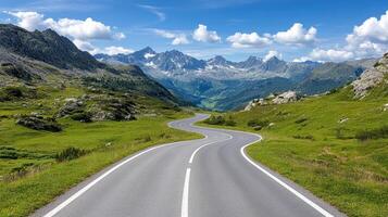 scenic mountain pass with winding roads surrounded by lush greenery and majestic peaks photo