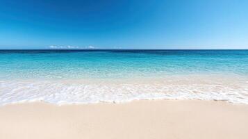 tranquil beach with clear blue sky and gentle waves lapping at shore photo