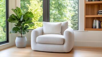 cozy library corner featuring plush chair and leafy plant photo