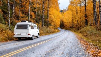 scenic road trip with camper van surrounded by autumn foliage photo