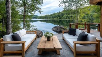 serene rustic patio with wooden furniture overlooking tranquil lake photo