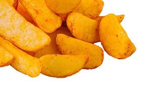 Crispy golden potato wedges on a white background photo