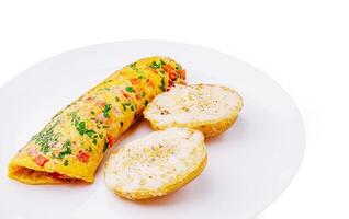 Delicious vegetable omelet served with seasoned potatoes photo