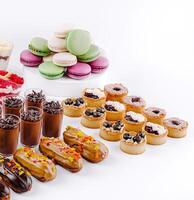 Delicious display of assorted pastries and desserts at a bakery photo