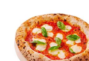 Freshly baked pizza with mozzarella and basil on white background photo