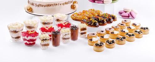 Desserts displayed in a festive arrangement at a celebration photo