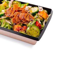 Fresh garden salad with colorful vegetables and crispy toppings photo