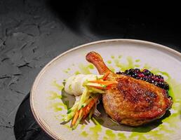 Elegant duck with berry sauce and fresh veggies photo