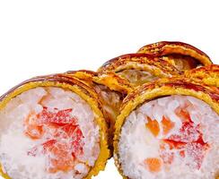 Tempura maki sushi rolls showing salmon and cream cheese filling on white background photo