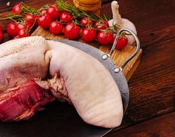 Preparing ingredients for traditional cooking with meat and tomatoes photo