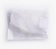 close up Crumpled white paper bag with blank label for branding mockup photo
