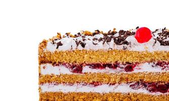 close up Delicious cake with chocolate sprinkles and cherry filling showing its layers photo