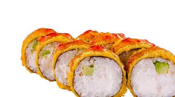 Tempura maki sushi rolls lying on white background close up photo