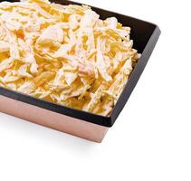 Creamy coleslaw served in a black plastic container photo