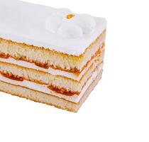 Close up Delicious cake with white icing and heart decoration isolated on white background photo
