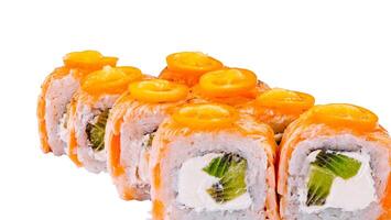 Close up Sushi rolls with salmon, cream cheese, kiwi and kumquat showing filling on white background photo