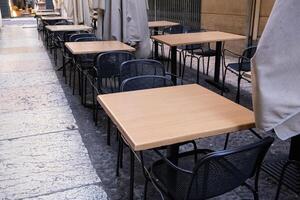Terrace with tables and chairs in the street photo
