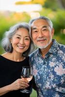 An older couple holding wine glasses photo