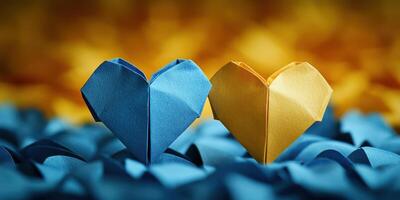 Heart-shaped origami pieces in blue and yellow surrounded by colorful paper background photo