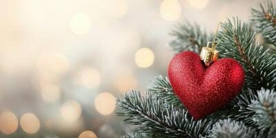 Beautiful red heart ornament hanging on a festive tree branch surrounded by twinkling lights during holiday celebrations photo