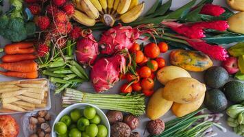 A set of fresh tropical vegetables and fruits purchased at a local Asian market photo