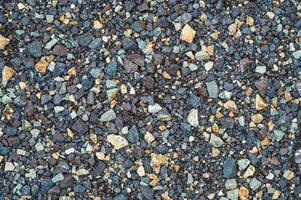 Crushed dark grey gravel stone texture horizontal photo