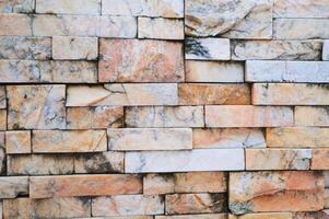 brick background, Abstract geometric pattern texture, Classic outdoor building granite blocks wall. photo