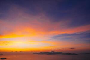 sunset cloudscape Panoramic with rich purple and pink tones blending into orange at horizon, twilight backdrop photo