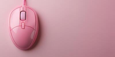 Stylish pink computer mouse on a pastel pink background creating a trendy workspace aesthetic photo