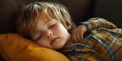 Young boy peacefully sleeping on a cozy couch with a soft pillow during a sunny afternoon photo