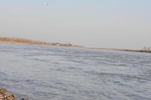 the water of river and blu sky photo